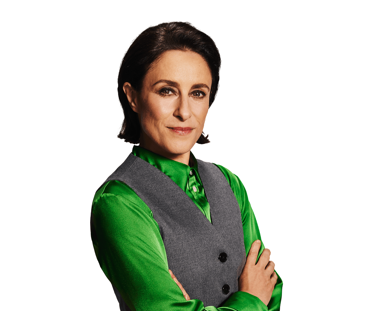 A woman wearing a green top